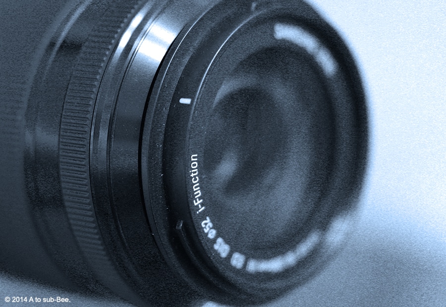 A macro image of a camera lens used to snap images of Bee