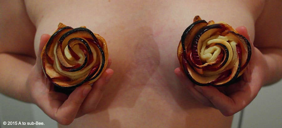 Bee felling rosy with her baked apple roses being held in front of their breasts