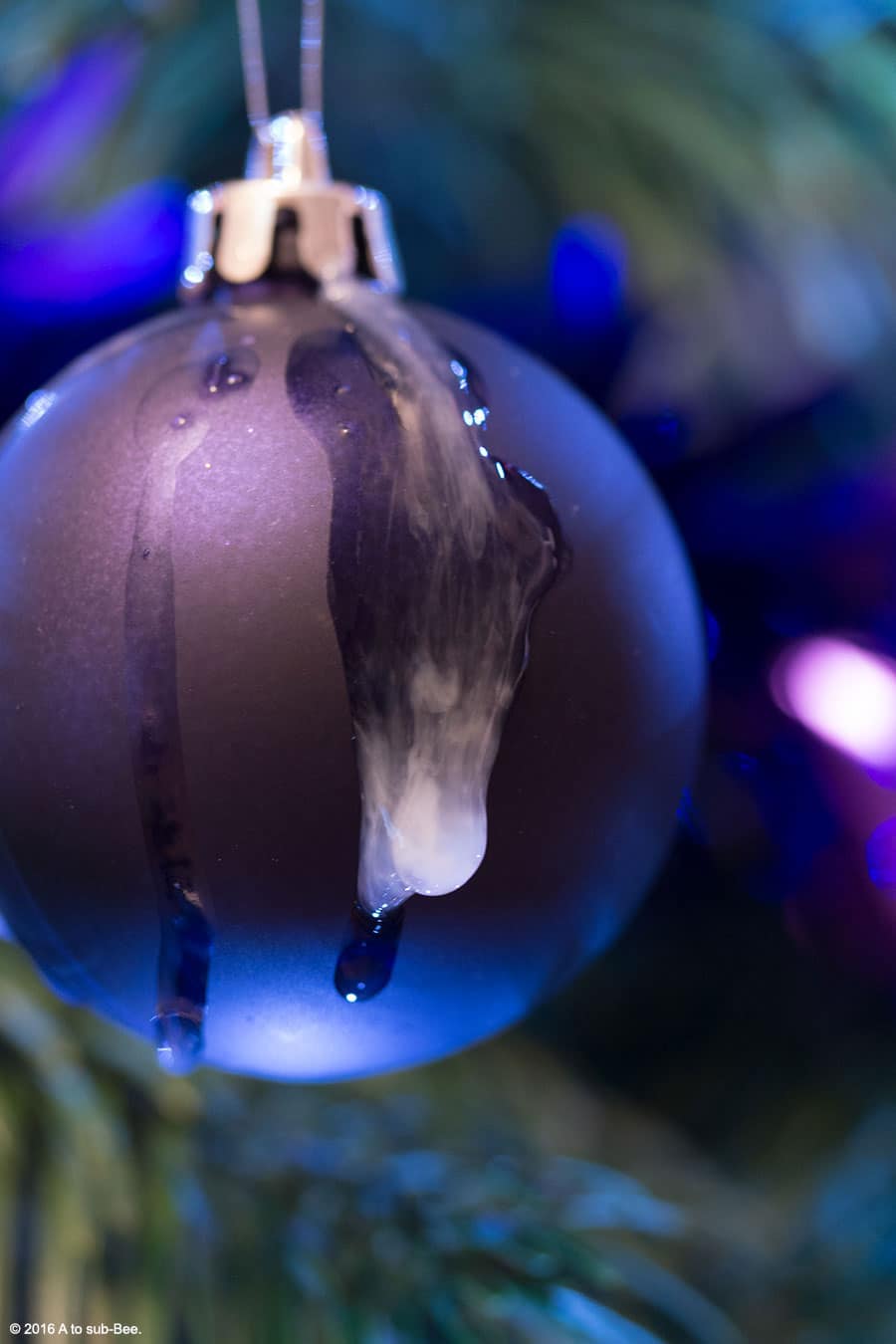 The Keeper cum dripping from a purple baubel on the Christmas tree as a play on Oh Come all ye Faithful