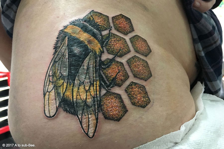 Bee's new tattoo of a bee on her hip