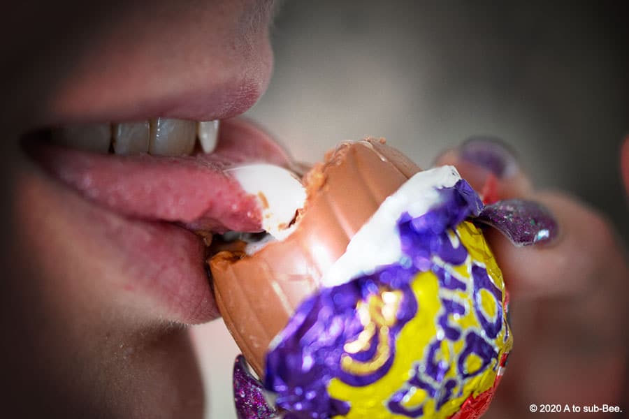 Bee licking the goo from a creme egg