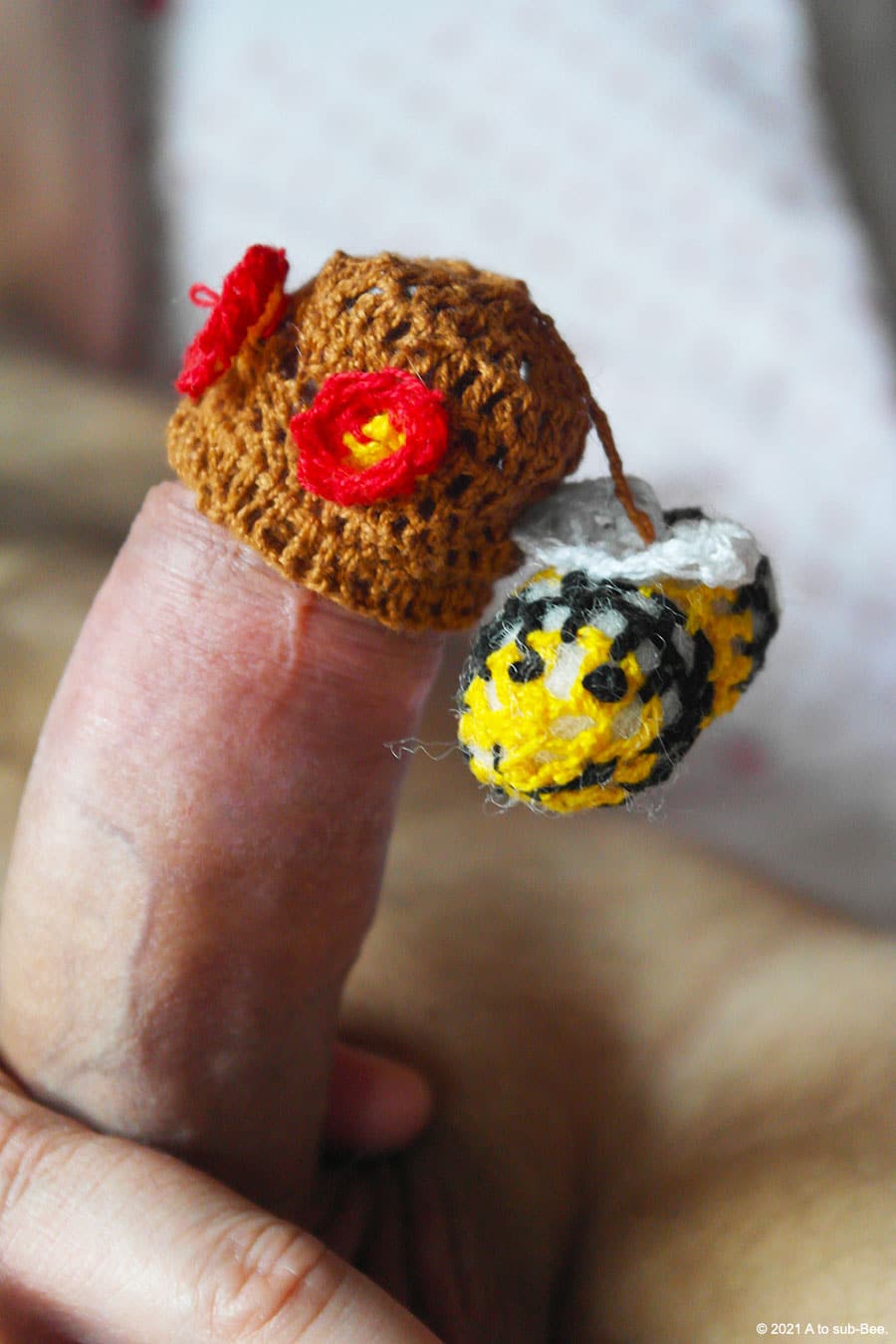 Bee Keepers cock wearing a hand made crocheted Easter, or is that Beeaster, bonnet